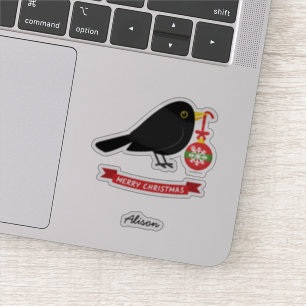 Niedlicher Blackbird mit einem Weihnachtsball-Indi Aufkleber