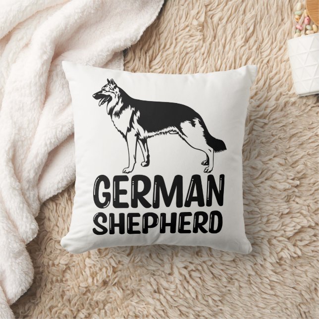 Niedlicher deutscher Schäferhund gibt Schwarz-weiß Kissen (Decke)