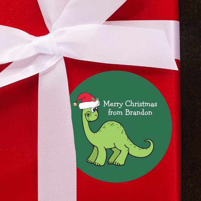 Niedlicher Dinosaurier in Weihnachtsmannmütze Kids Runder Aufkleber (Von Creator hochgeladen)