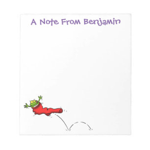Niedlicher Frosch in einem roten Cartoon Notizblock