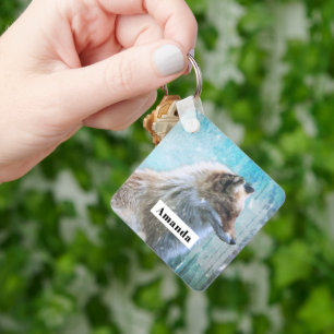 Niedlicher Furry Fox auf Blue Grunge Hintergrund Schlüsselanhänger