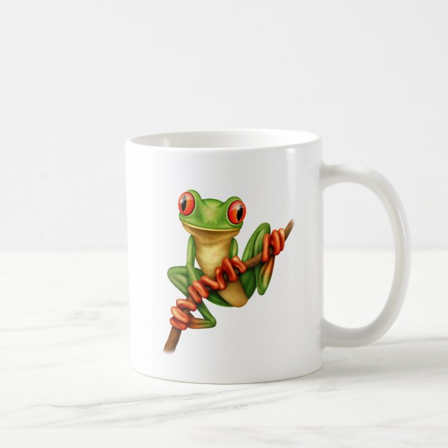 Niedlicher grüner Baum-Frosch auf einer Kaffeetasse (Rechts)