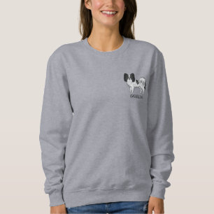 Niedlicher Hund aus schwarz-weißem Papillon mit be Sweatshirt