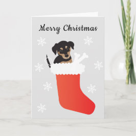 Niedlicher Hund in einem Strumpf Schneeflocken Feiertagskarte