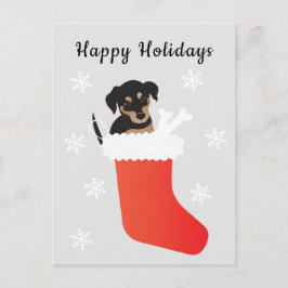 Niedlicher Hund in einem Strumpf Schneeflocken Postkarte