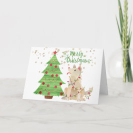 Niedlicher Hund in Weihnachtsbeleuchtung neben Bau Karte