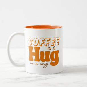 Niedlicher Kaffee ist eine Umarmung in der Tasse W