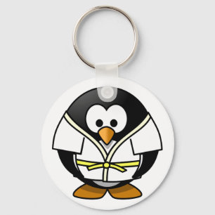 Niedlicher, kleiner, animierter Judo-Pinguin Schlüsselanhänger