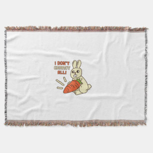 Niedlicher kleiner Bunny hält seine Karotte Decke