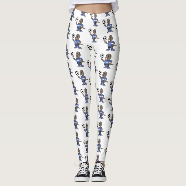Niedlicher Komodo-Drache beim Fußballspielen Carto Leggings (Vorderseite)
