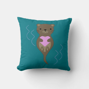Niedlicher Otter umarmt ein rosa Herz Kissen