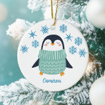 Niedlicher Personalisierter Pinguin Snowflake Kind Keramik Ornament<br><div class="desc">Ein hübscher Pinguin in einem aquamarinen Pullover unter schönen blauen Schneeflocken. Passen Sie dieses niedliche Weihnachtsgeschenk mit dem Namen eines Freundes für einen bezaubernden personalisierten Weihnachtsschmuck an.</div>