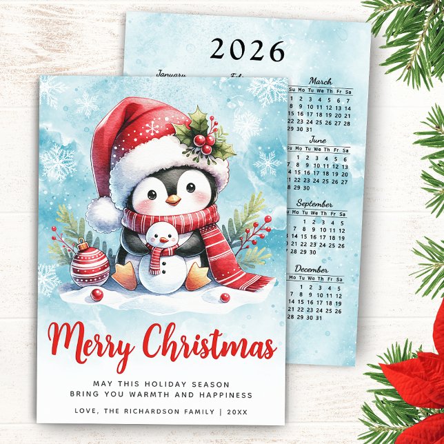 Niedlicher Pinguin Blau und Rot Frohe Weihnachten (Merry Christmas Card with a Cute Penguin in a Santa Hat, 2026 Calendar on a Backside of the Card)