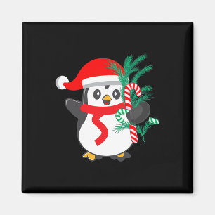 Niedlicher Pinguin, der ein Candy Cane Weihnachtst Magnet