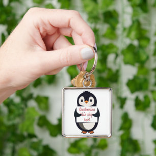 Niedlicher Pinguin hält ein Schild für personalisi Schlüsselanhänger