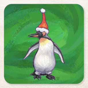 Niedlicher Pinguin in der Weihnachtsmannmütze über Rechteckiger Pappuntersetzer
