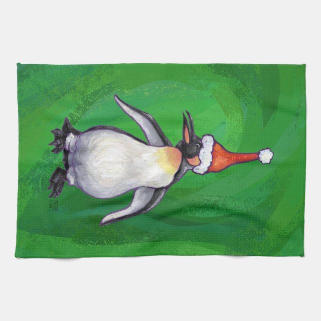 Niedlicher Pinguin in Weihnachtsmannmütze auf Gree Handtuch (Horizontal)