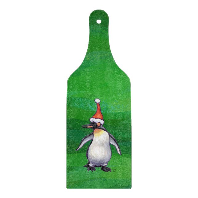 Niedlicher Pinguin in Weihnachtsmannmütze auf Gree Schneidebrett (Vorderseite)