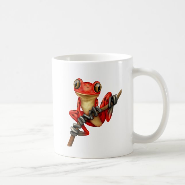 Niedlicher roter Baum-Frosch auf einer Kaffeetasse (Rechts)