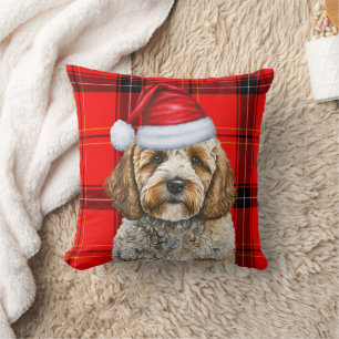 Niedlicher Santa Cockapoo Hund auf Karierten Weihn Kissen