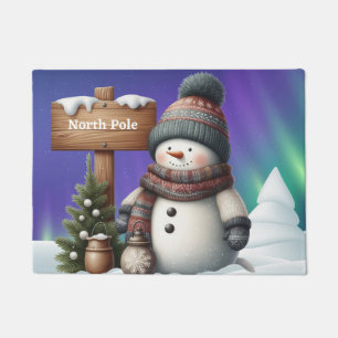 Niedlicher Schneemann am Nordpol mit Nordlichter Fußmatte