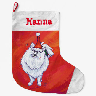 Niedlicher Spitz in der Weihnachtsmannmütze auf Ro Großer Weihnachtsstrumpf