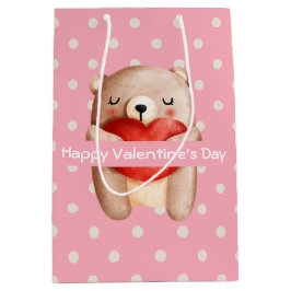 Niedlicher Teddybär, der ein Valentinisches Rotes  Mittlere Geschenktüte