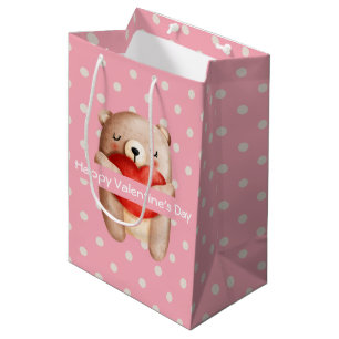 Niedlicher Teddybär, der ein Valentinisches Rotes  Mittlere Geschenktüte