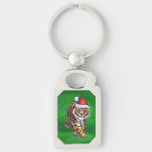Niedlicher Tiger in der Weihnachtsmannmütze über g Schlüsselanhänger