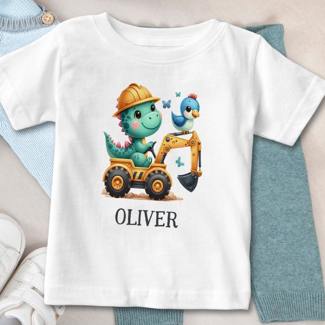 Niedlicher Trex Dinosaurier, der ein Baufahrzeug f Baby T-shirt (Von Creator hochgeladen)