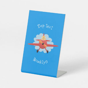 Niedlicher Vogel mit rotem Flugzeug Cartoon Abbild Sockelschild