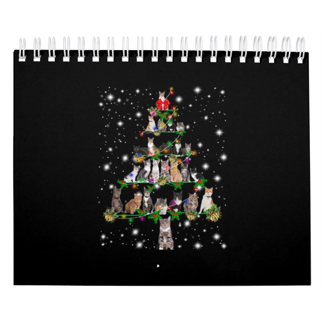 Niedlicher Weihnachtsbaum der Katze, gedeckt durch Kalender (Titelbild)