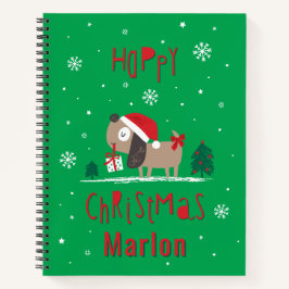 Niedlicher Weihnachtshund mit Geschenk für grün Notizbuch