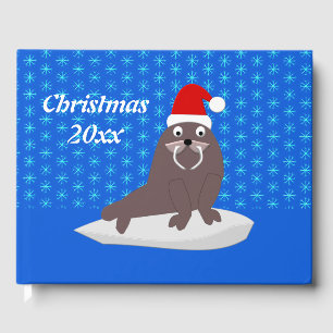 Niedlicher Weihnachtswalrus und Schneeflocken Gästebuch