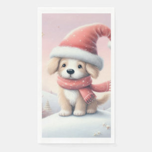 Niedlicher Weihnachtswelpen in der Weihnachtsmannm Serviette