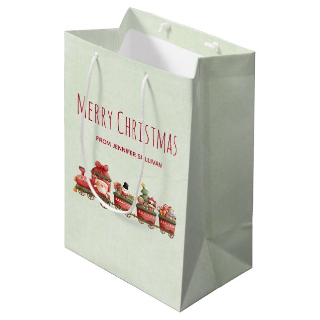 Niedlicher Weihnachtszug mit Spielzeug Mittlere Geschenktüte (Vorderseite Schrägansicht)