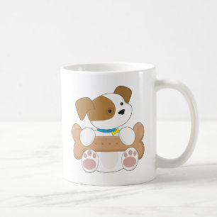 Niedlicher Welpe mit einem Imbiss Kaffeetasse