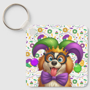 Niedlicher Welpenhund Mardi Gras in der Hut Schlüsselanhänger