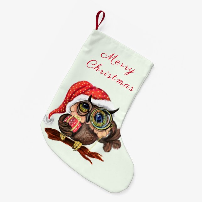 Niedliches Babyschale in Weihnachtshut und Geschen Kleiner Weihnachtsstrumpf (Vorderansicht (hängend))