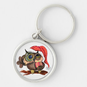 Niedliches Babyuscheln in Weihnachtshut und -gesch Schlüsselanhänger