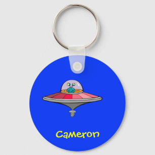 Niedliches Cartoon-alien in UFO-personalisiertem Schlüsselanhänger