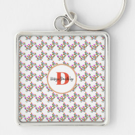 niedliches, farbiges, blumengeschmücktes Monogramm Schlüsselanhänger