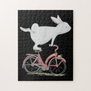 Niedliches Kaninchen auf dem Fahrrad Fahrrad