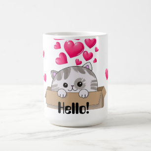 Niedliches Kätzchen, das aus einer Kiste heraussch Kaffeetasse