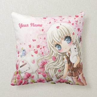 Niedliches Mädchen mit weißer Katze auf rosa Kissen