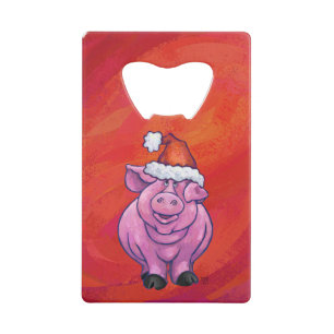 Niedliches Schwein in Weihnachtsmannmütze auf Rot Kreditkartenflaschenöffner