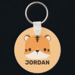 Niedliches Tiger mit Personalisiertem Namen Schlüsselanhänger<br><div class="desc">Ein niedliches Design,  das Ihren Tag aufhellt. Dieses Design bietet eine niedliche Tiger Cartoon-Abbildung mit personalisiertem Namen in braun modernen Sans Serif Schriftart Stil auf pastellorange Hintergrund. Perfekte personalisierte Geschenke für Kinder.</div>