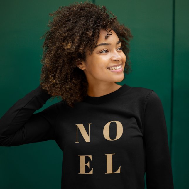 Noel Black and Gold Trendy Stylish Christmas Sweatshirt (“Noel” Christmas sweatshirt by Guava, featuring bold gold typography on a sleek black fabric)
