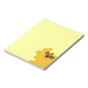 Notepad mit Honigbiene auf einer Honigwabe Notizblock