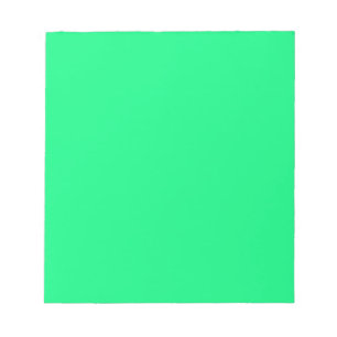 Notizblock mit leuchtend neon-grünem Hintergrund